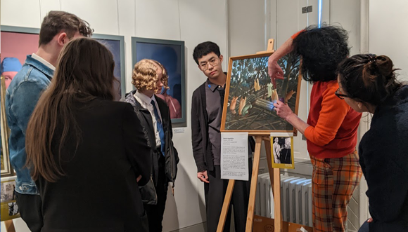 Christina Young explains in more depth about conservation requirements on painting ‘Cutting Wood’ by Sam Ntiro (1)