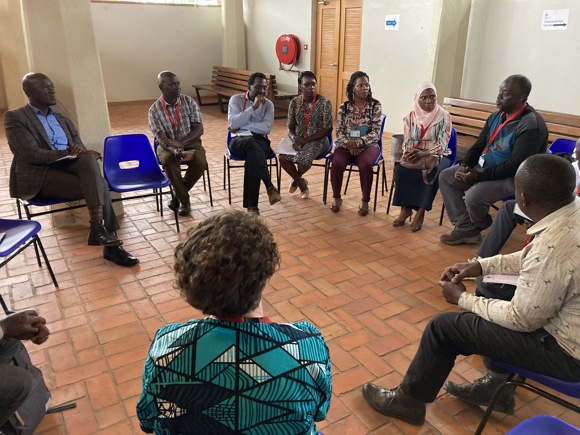 Prof Angelo Kakande, Dr Deirdre Mackenna And Dr Kate Cowcher With Attendees At British Council Kampala, Uganda 29.01.2024. Image Courtesy Of CHARTS 2